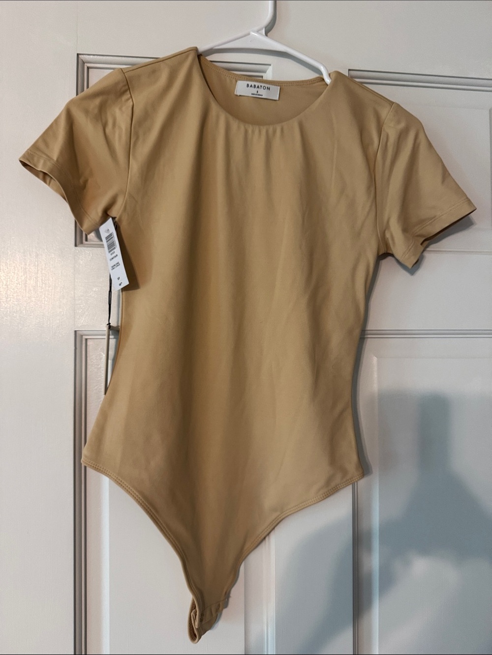 Babaton  Short Sleeve One-Piece Bodysuit in Beige Tan